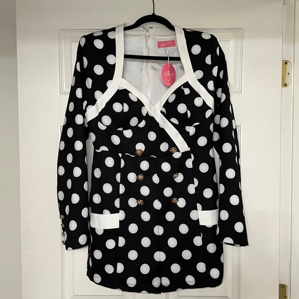 Black and white polka dot romper with gold buttons